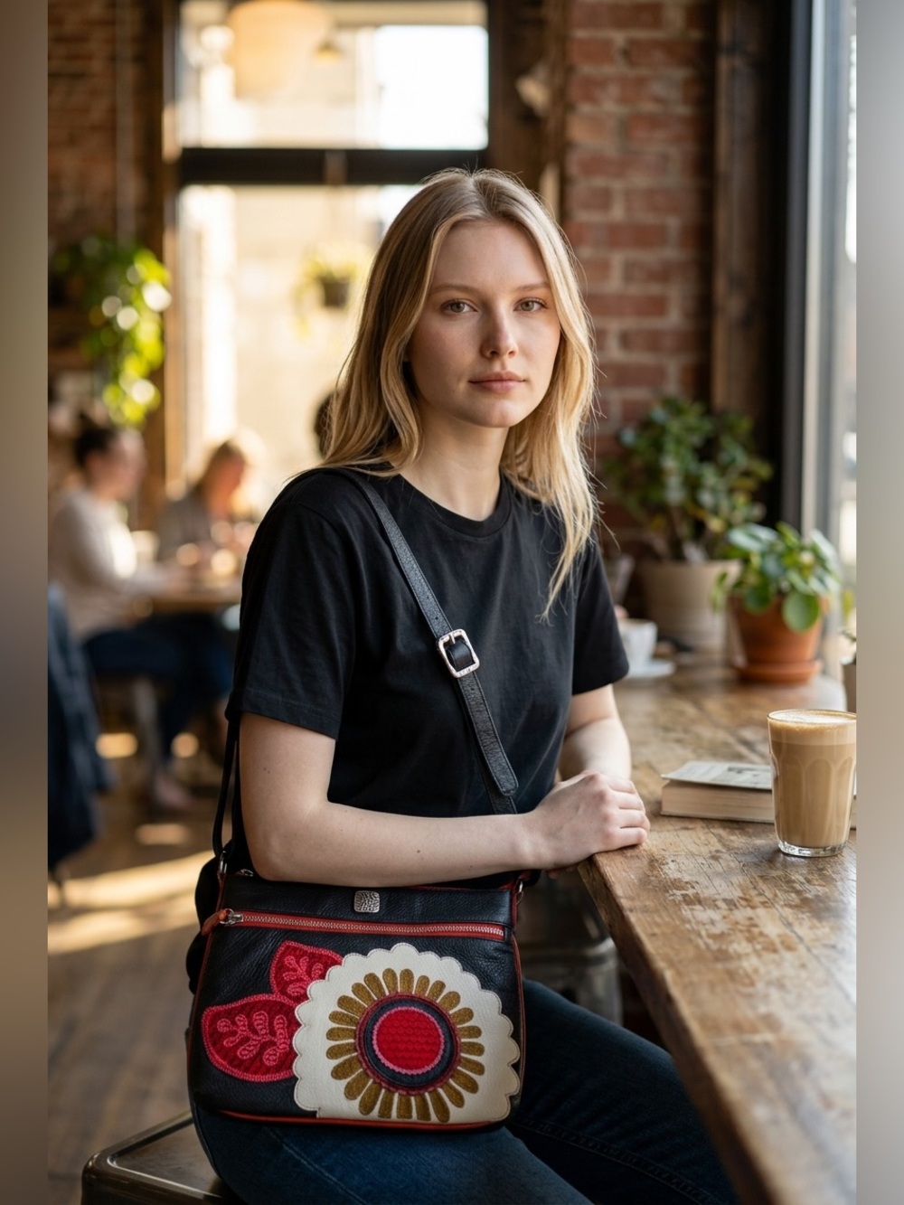BRIGHTON Black Crossbody Bag with Striking Red and Cream Floral Appliqué